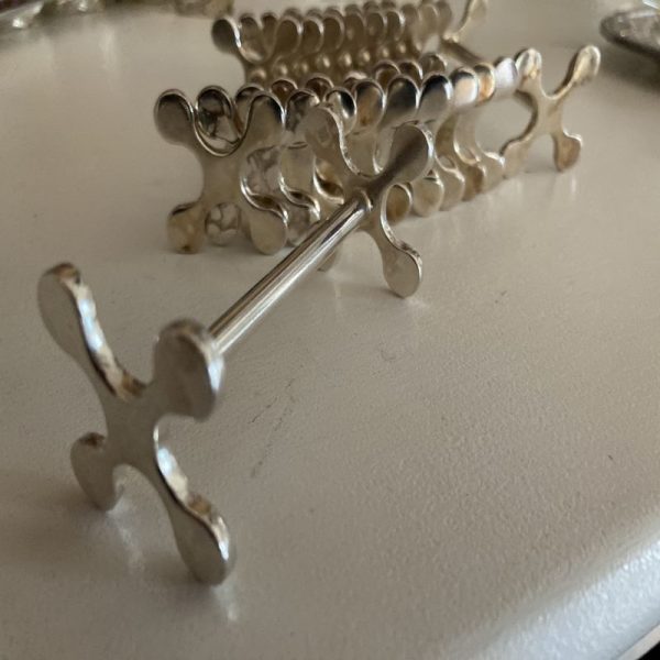 18 porte couteaux en métal argenté décor flocon